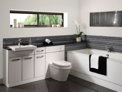 Modern bathroom with fitted vanity unit, toilet and bathtub